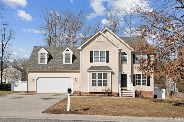 view of property with a garage and a front lawn