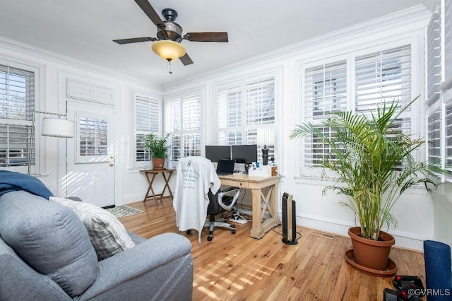 office with hardwood / wood-style floors, crown molding, and ceiling fan