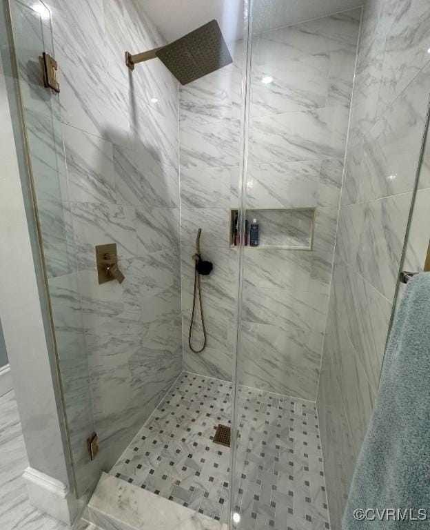 bathroom featuring an enclosed shower