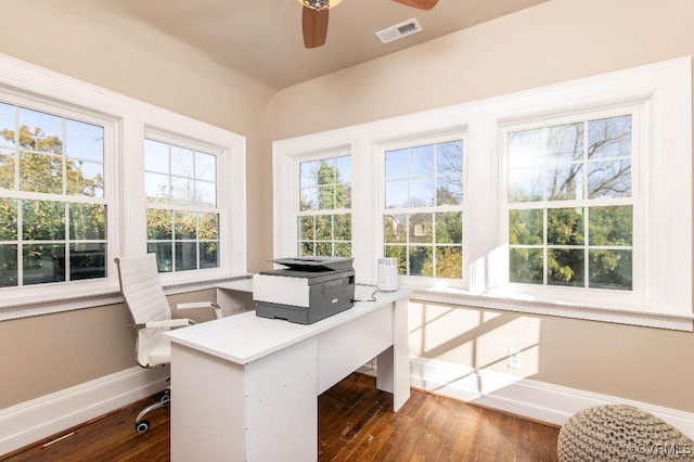 home office with dark wood-type flooring and ceiling fan