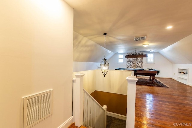 interior space with hardwood / wood-style flooring, built in shelves, lofted ceiling, and billiards