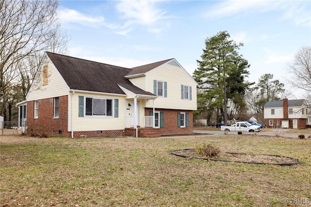 tri-level home with crawl space, roof with shingles, and a front lawn