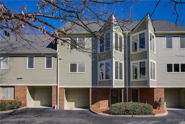 view of side of property with a garage