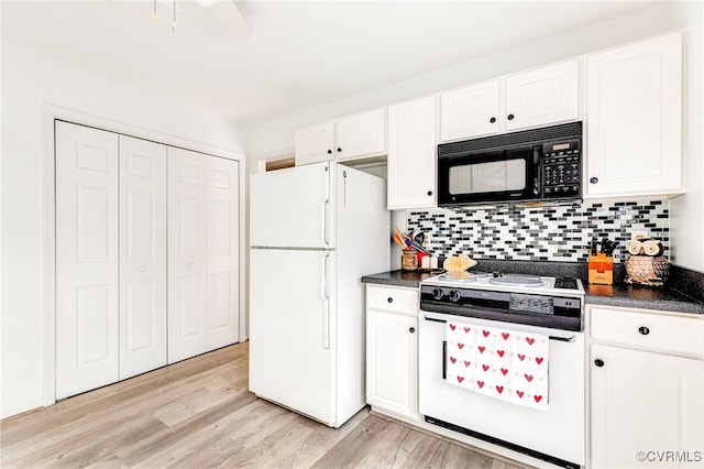 kitchen featuring tasteful backsplash, dark countertops, light wood-style floors, white cabinets, and white appliances