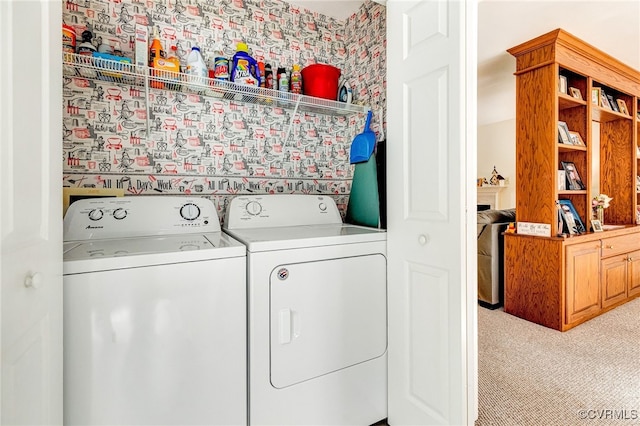 laundry room featuring laundry area, washer and clothes dryer, and light colored carpet