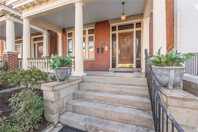 doorway to property with a porch