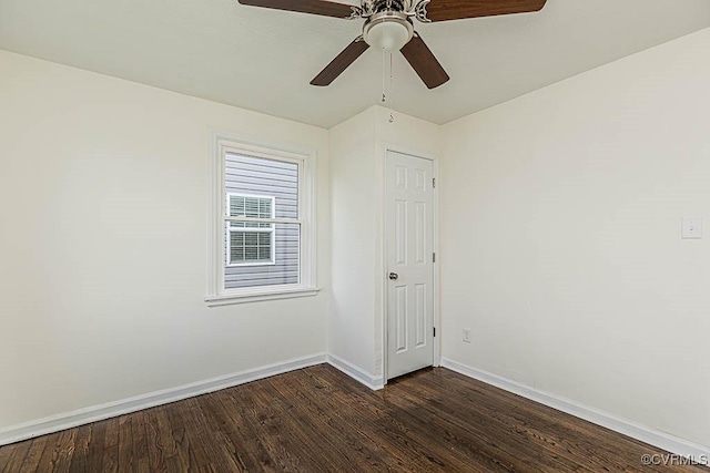 spare room with dark hardwood / wood-style flooring