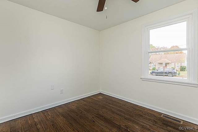 empty room featuring hardwood / wood-style floors and ceiling fan