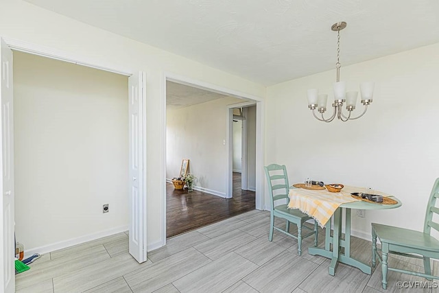 dining area featuring an inviting chandelier