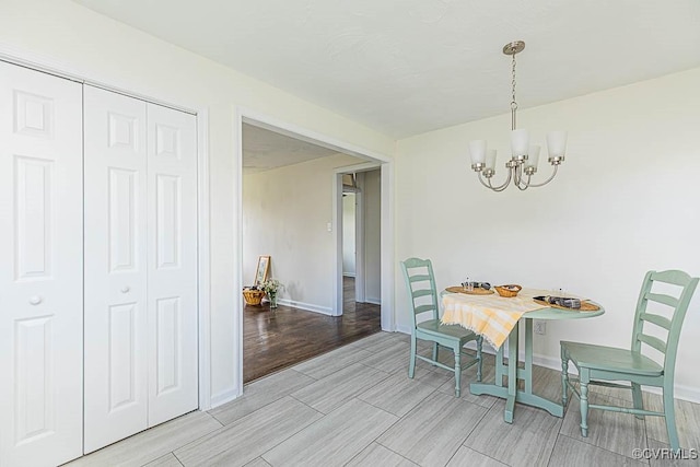 dining room with a notable chandelier