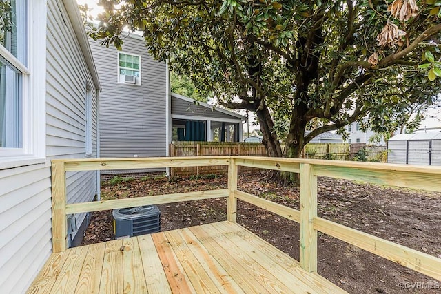 wooden deck featuring central AC unit