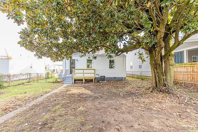 back of property featuring central air condition unit