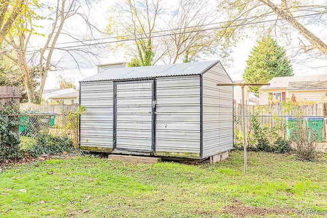 view of outbuilding with a lawn