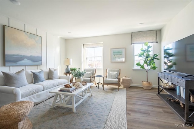 living room featuring light hardwood / wood-style flooring and a wealth of natural light