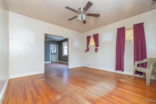 empty room with wood-type flooring and ceiling fan