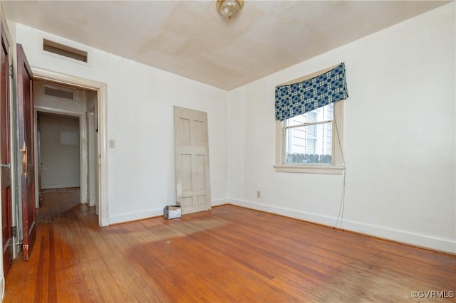 unfurnished bedroom with wood-type flooring