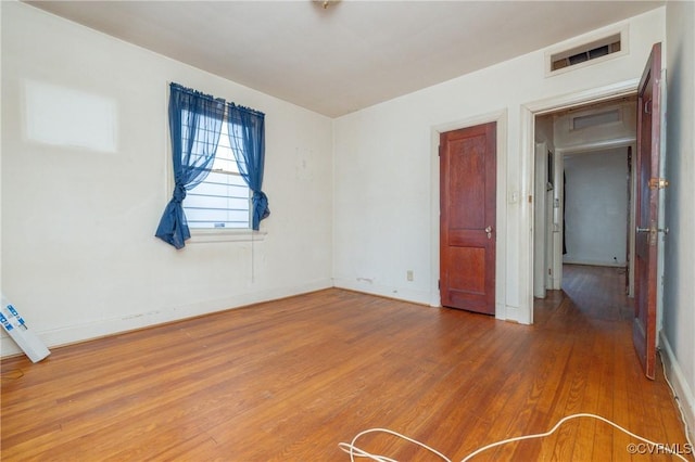 unfurnished bedroom featuring hardwood / wood-style floors