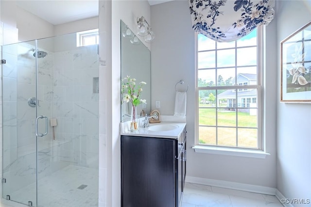 bathroom with a shower with door and vanity