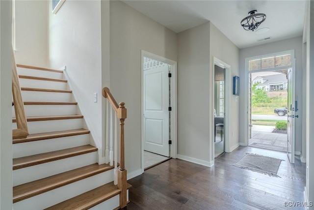 foyer featuring dark wood-type flooring