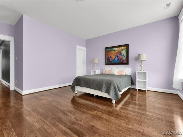 bedroom featuring dark wood-type flooring