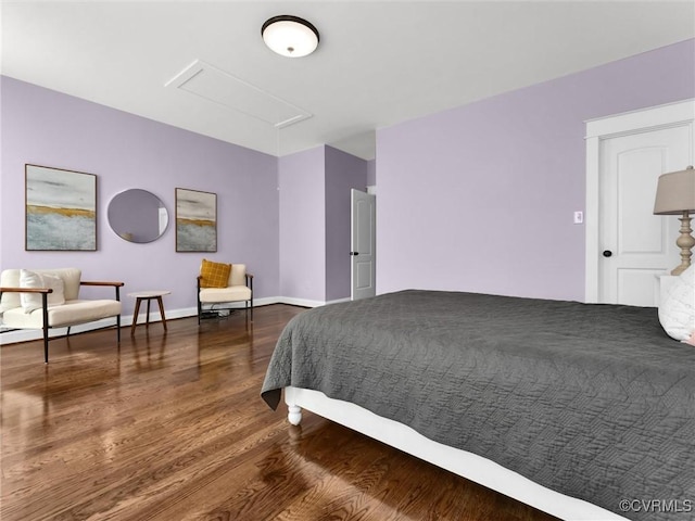 bedroom with hardwood / wood-style flooring