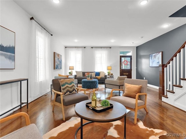 living room with dark hardwood / wood-style flooring