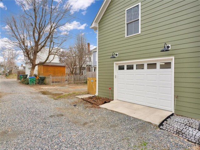 view of side of property featuring a garage