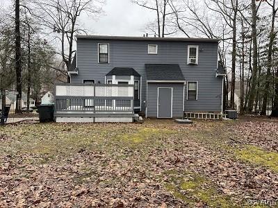 rear view of property with a deck