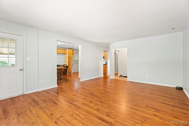 803 Lake Caroline Dr, Abingdon, VA 22546 - unfurnished living room with light wood-type flooring and baseboards