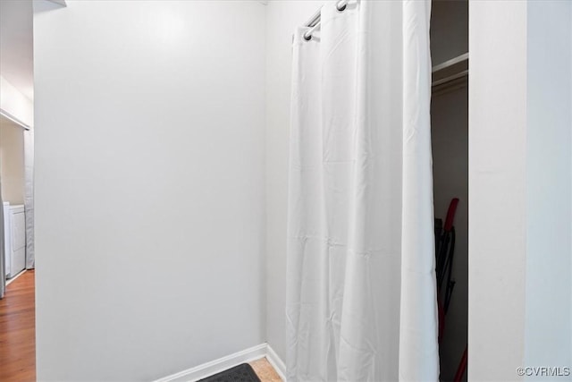 803 Lake Caroline Dr, Abingdon, VA 22546 - bathroom with washer / clothes dryer, wood finished floors, and baseboards