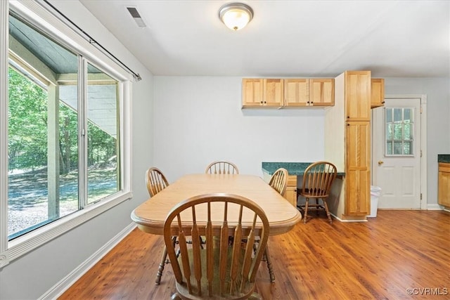 803 Lake Caroline Dr, Abingdon, VA 22546 - dining area featuring plenty of natural light, light wood finished floors, and baseboards