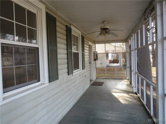 exterior space featuring ceiling fan and covered porch