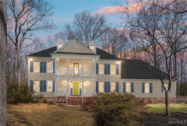 view of front facade featuring a yard, roof with shingles, crawl space, and a balcony