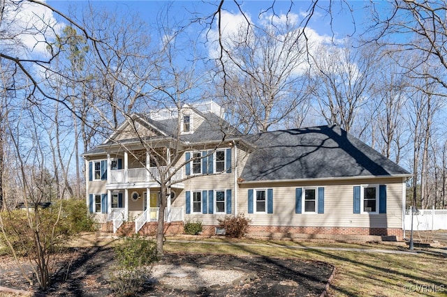 view of front of home featuring a porch and a balcony