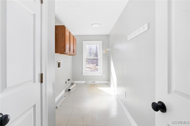 clothes washing area with washer hookup, cabinet space, visible vents, hookup for an electric dryer, and baseboards