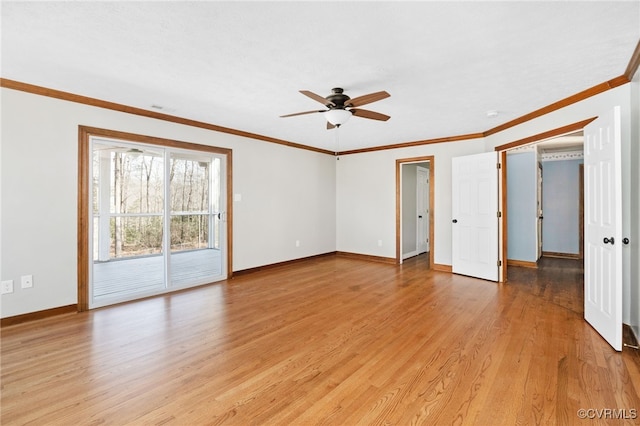 empty room with crown molding, light wood finished floors, visible vents, a ceiling fan, and baseboards