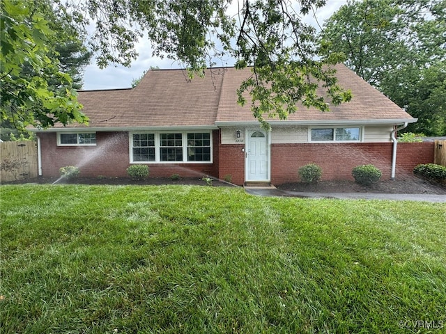 view of front of property with a front lawn