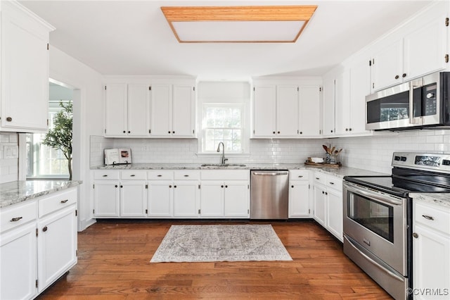 kitchen with white cabinetry and appliances with stainless steel finishes