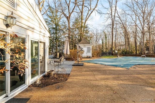 view of swimming pool with a fenced in pool, a patio area, and fence