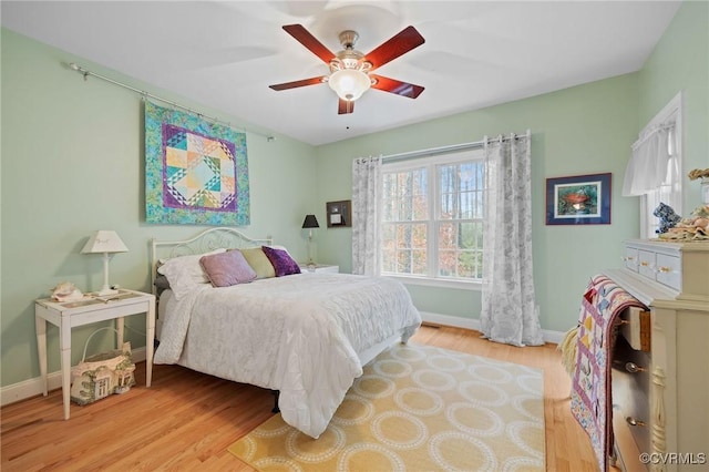 bedroom featuring ceiling fan and light hardwood / wood-style flooring