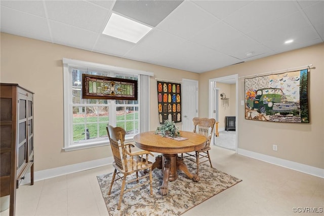 dining room with a paneled ceiling