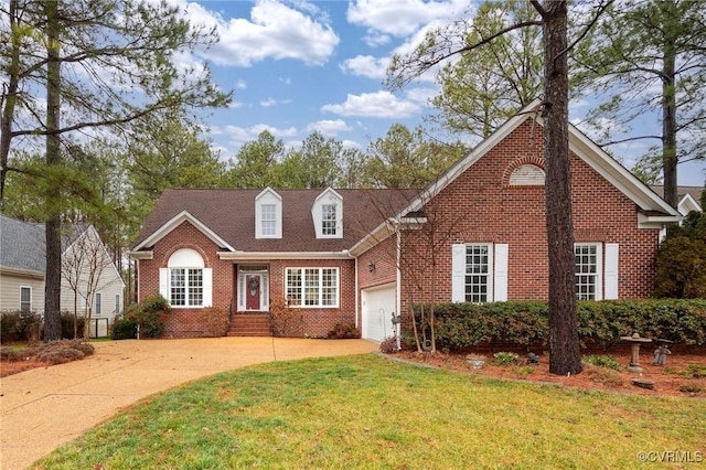 view of front of house with a garage and a front yard