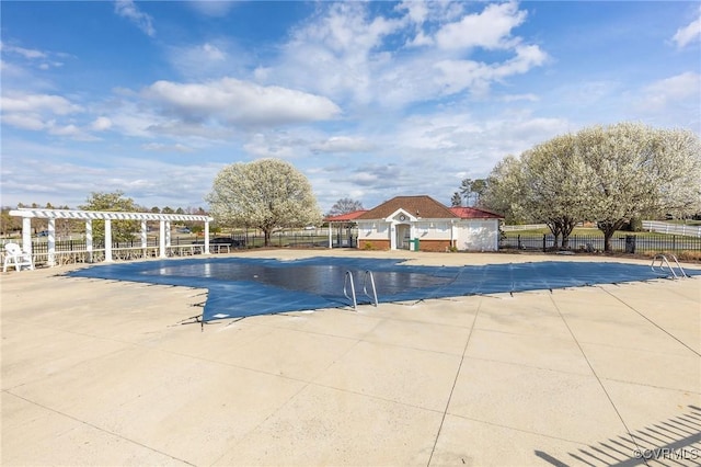 view of swimming pool featuring a patio area and a pergola