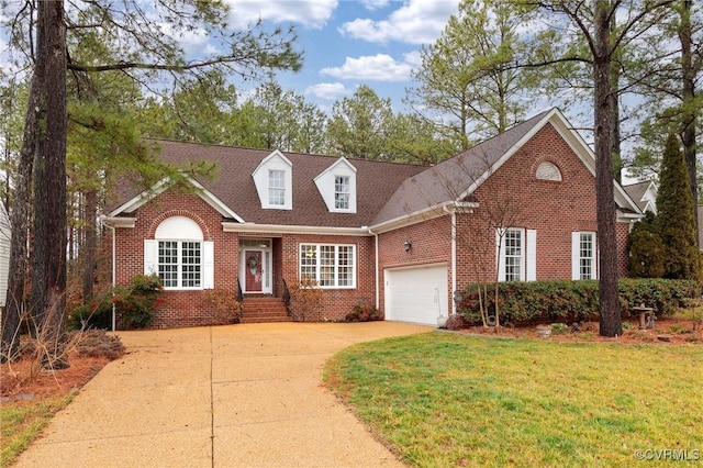 cape cod-style house with a garage and a front yard