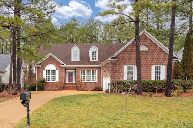 view of front of house with a garage and a front yard