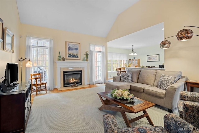 living room featuring vaulted ceiling and light hardwood / wood-style flooring