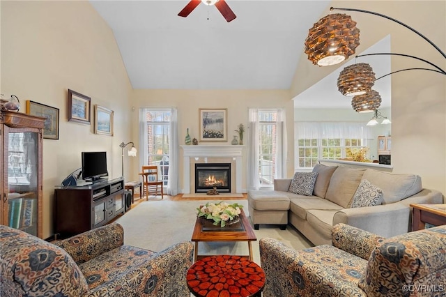 carpeted living room featuring high vaulted ceiling and ceiling fan