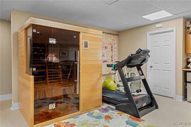 workout area with a drop ceiling