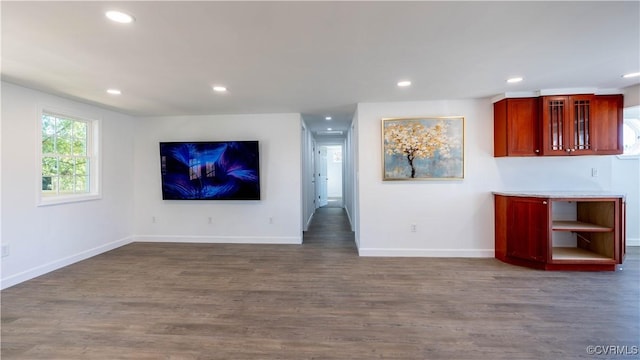 unfurnished living room with dark hardwood / wood-style floors