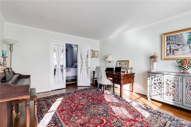 home office with wood-type flooring, ornamental molding, and french doors